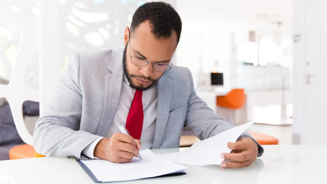Auditor reviewing a financial document