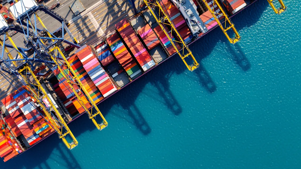 Aerial view of a port with ships and containers